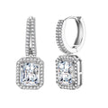 Sterling silver huggie hoops with emerald-cut moissanite drops featuring pavé-set crystals on white background.