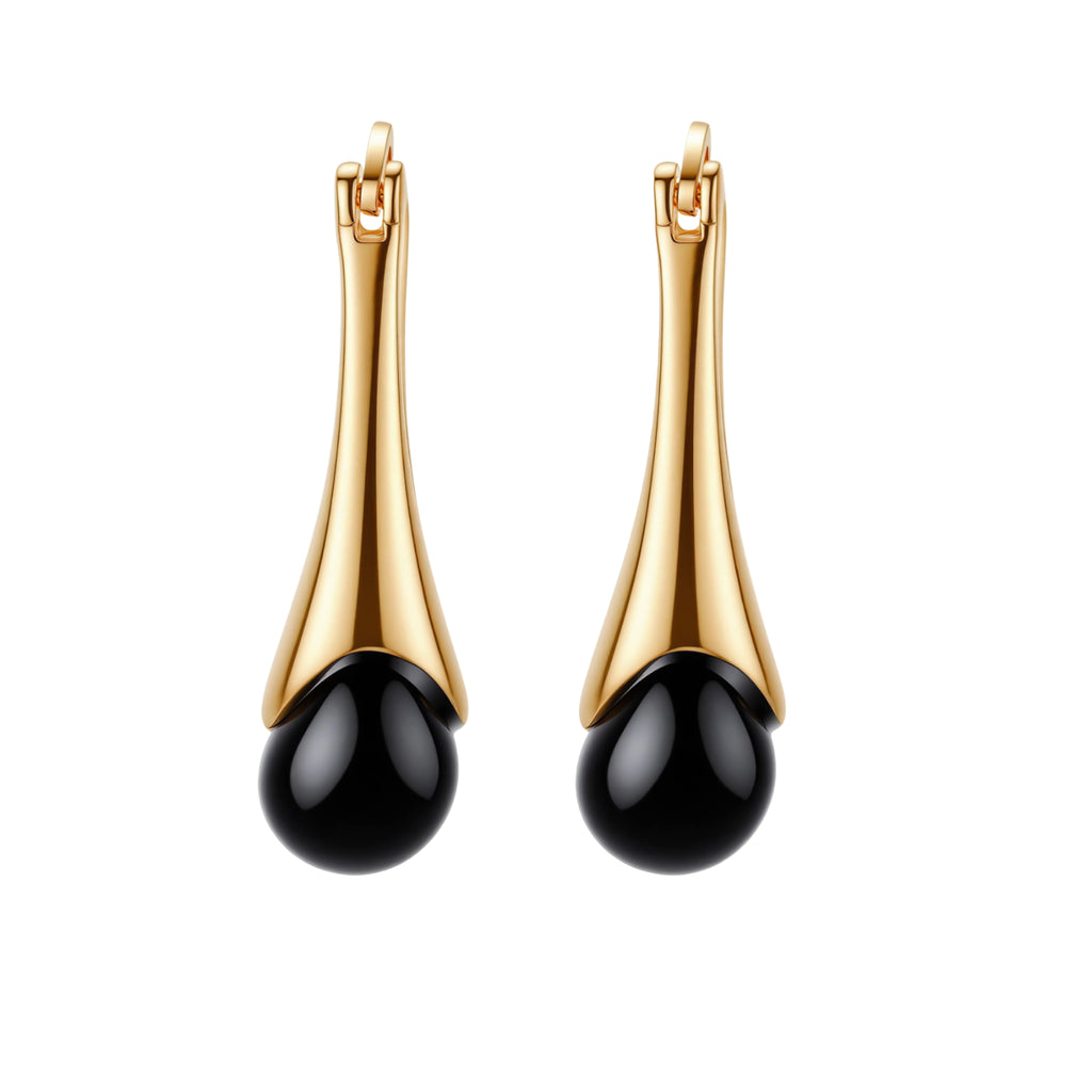 Gold-plated drop earrings featuring black agate stones with hoop closure on white background, showing elegant teardrop design.