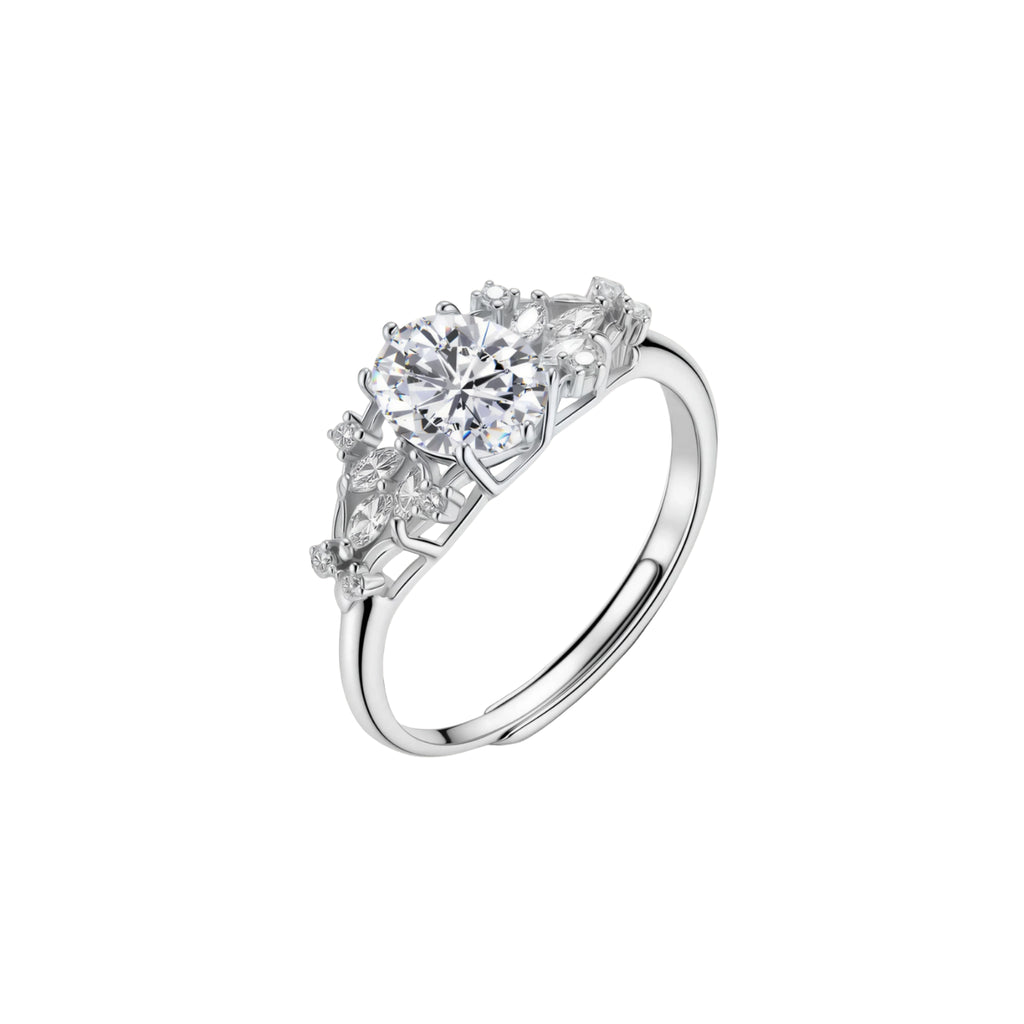 Sterling silver ring with oval moissanite center stone surrounded by smaller accent stones in ornate setting
