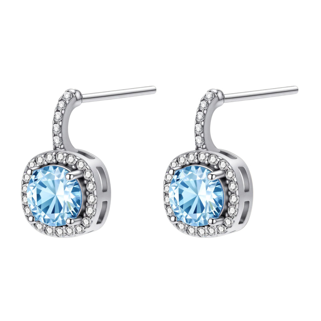 Sterling silver drop earrings featuring cushion-cut blue moissanite stones surrounded by sparkling halo settings