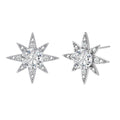 Sterling silver star-shaped stud earrings with brilliant moissanite center stones and pavé details on neutral background.