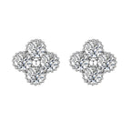 Dainty sterling silver quatrefoil stud earrings with four brilliant moissanite stones and center accent on white background.