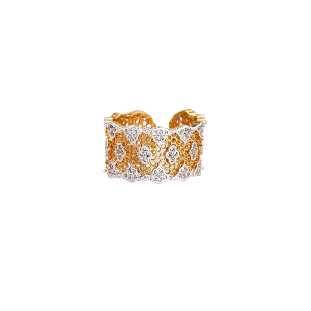 Two-tone gold and silver lattice ring with clover pattern and crystal accents on white background