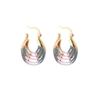 Gold hoop earrings with gradient blue-to-pink enamel in ribbed fan design on beige background