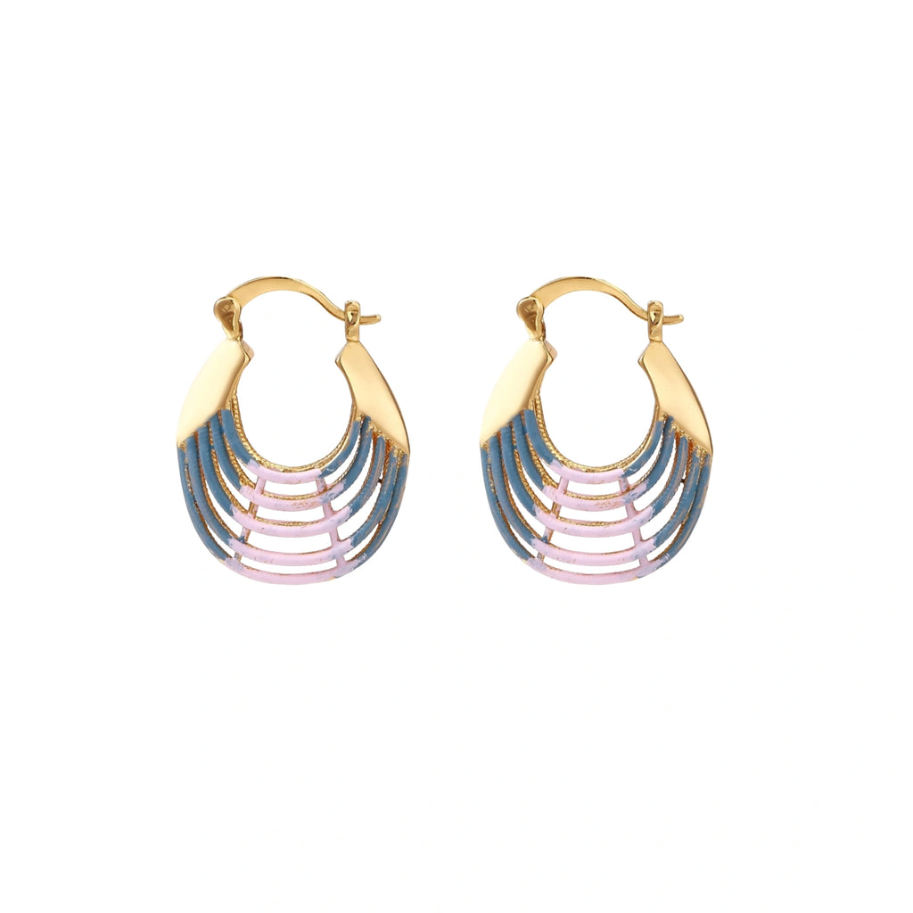 Gold hoop earrings with gradient blue-to-pink enamel in ribbed fan design on beige background
