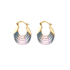 Gold hoop earrings with gradient blue-to-pink enamel in ribbed fan design on beige background