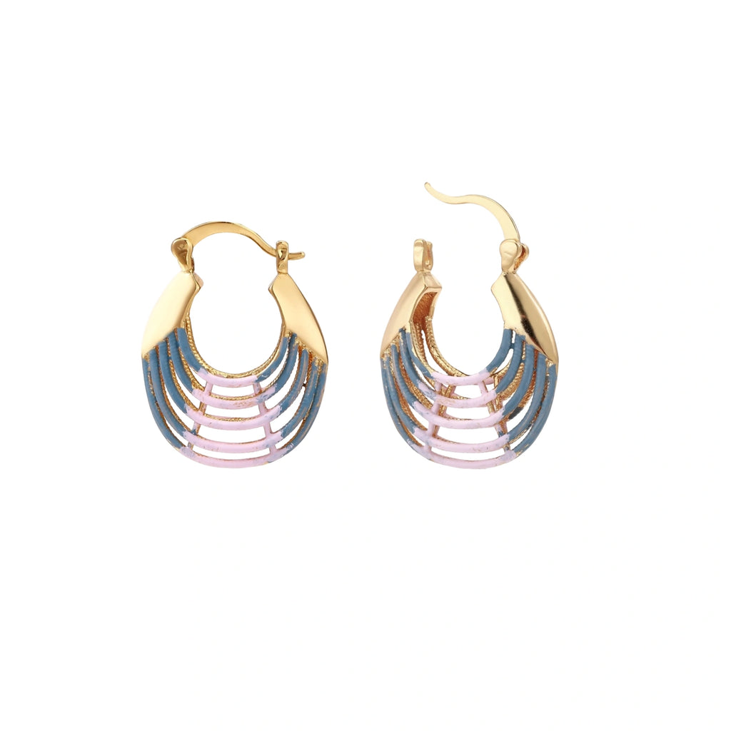 Gold hoop earrings with gradient blue-to-pink enamel in ribbed fan design on beige background