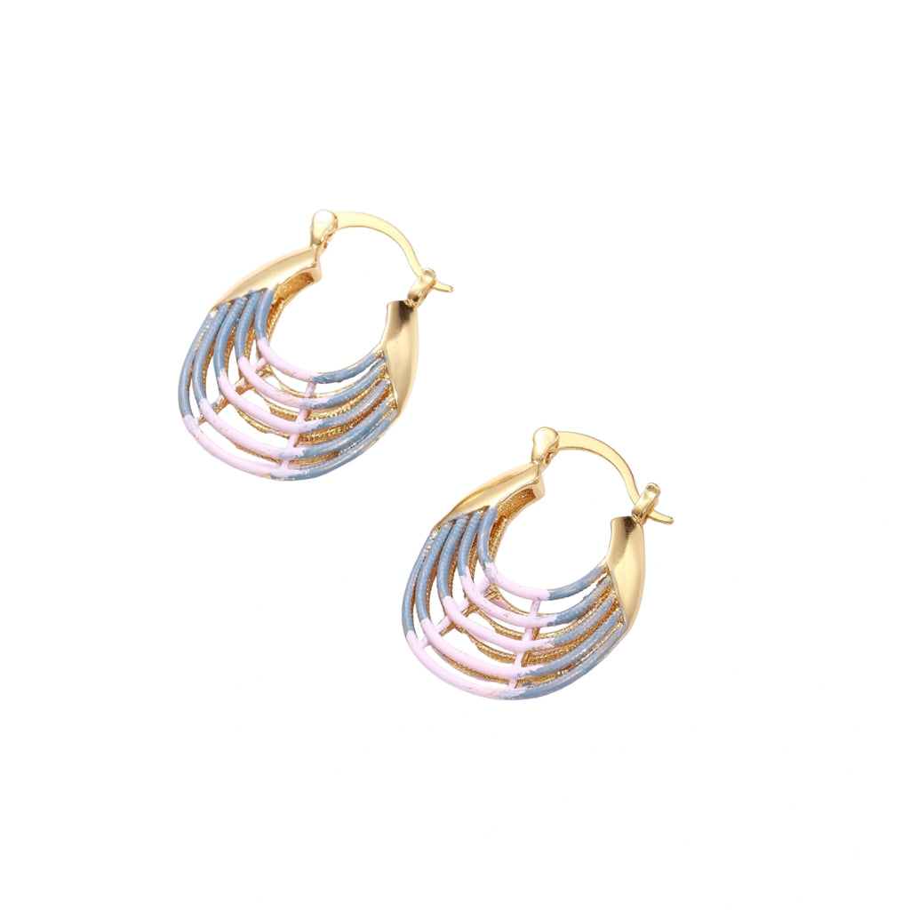 Gold hoop earrings with gradient blue-to-pink enamel in ribbed fan design on beige background