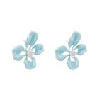 Turquoise enamel flower stud earrings with marbled finish and crystal centers on 18K gold plated brass