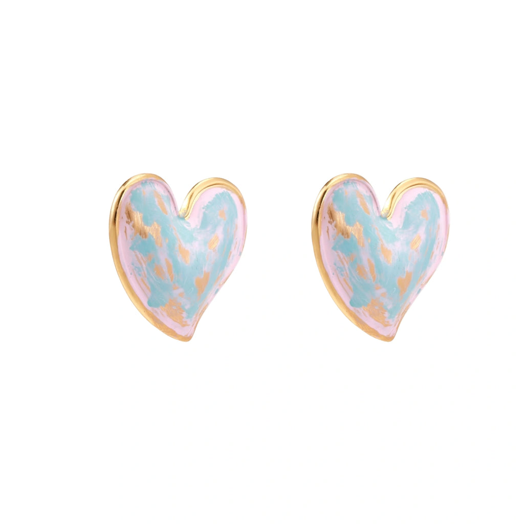 Heart-shaped stud earrings with swirled turquoise and pink enamel in gold-plated frames on cream background