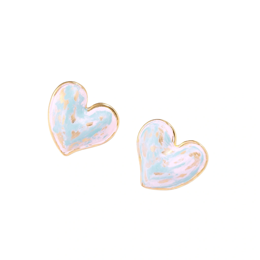 Heart-shaped stud earrings with swirled turquoise and pink enamel in gold-plated frames on cream background