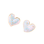 Heart-shaped stud earrings with swirled turquoise and pink enamel in gold-plated frames on cream background