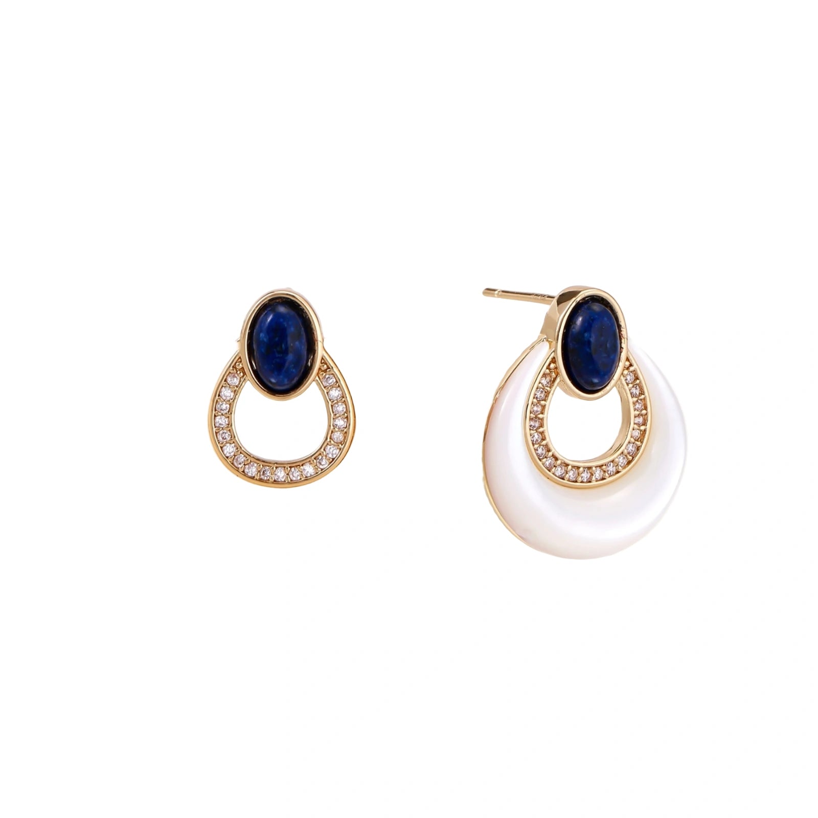 Gold drop earrings with oval lapis lazuli, crystal-paved frame, and iridescent mother-of-pearl teardrop on cream background
