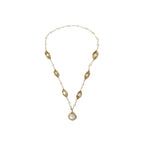 14K gold plated necklace with organic leaf motifs and freshwater pearls arranged in an elegant chain design on neutral background.