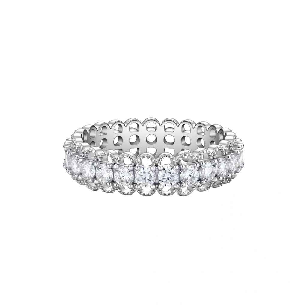 Sterling silver eternity ring with continuous row of brilliant moissanite stones in scalloped crown setting with milgrain detail