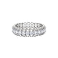 Sterling silver eternity ring with continuous row of brilliant moissanite stones in scalloped crown setting with milgrain detail