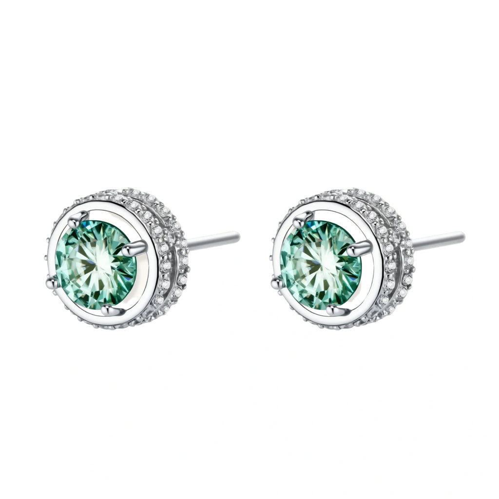 Round green moissanite stud earrings in sterling silver halo settings with brilliant sparkle on white background.