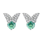 Sterling silver butterfly stud earrings with crystal wings and mint green center stones on cream background.