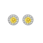 Dainty sterling silver stud earrings with yellow moissanite center stones surrounded by white halo stones
