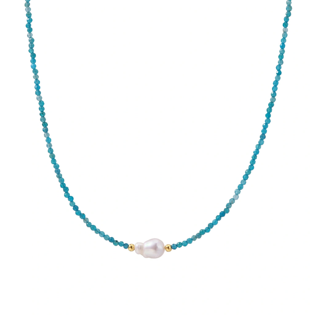 Delicate gold vermeil necklace with teal apatite beads and freshwater pearl on white background.