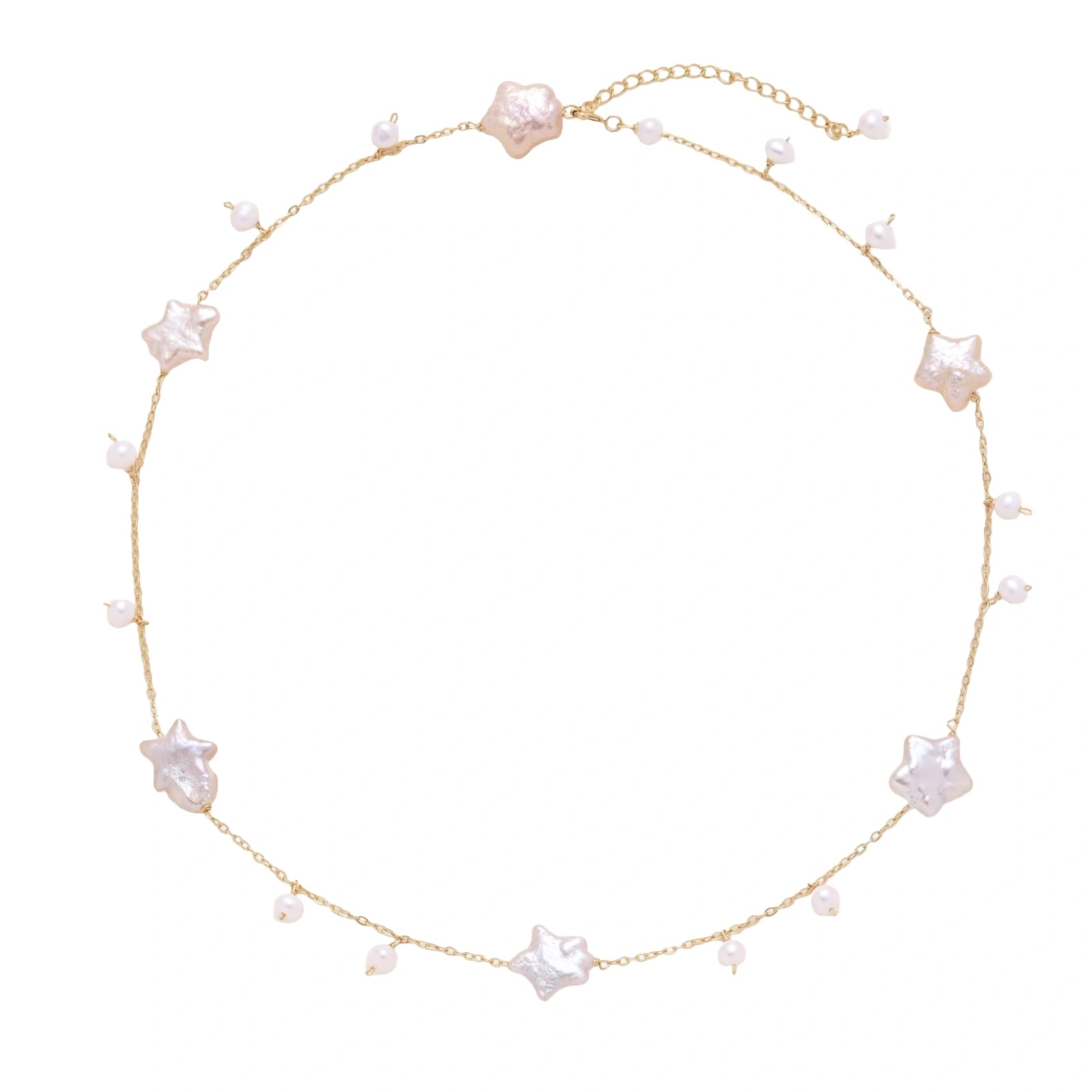 Gold vermeil chain with iridescent star-shaped baroque pearls and small round freshwater pearl drops on cream background.