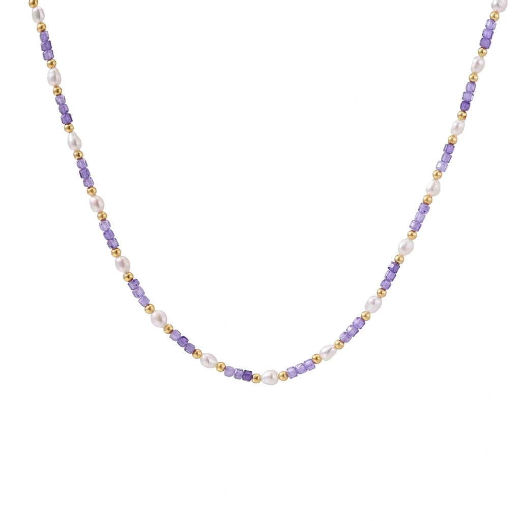 Delicate 18K gold vermeil necklace with alternating lavender zirconia beads and white freshwater pearls on cream background