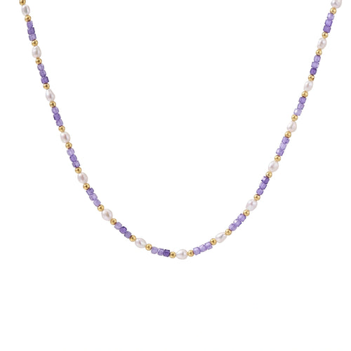 Delicate 18K gold vermeil necklace with alternating lavender zirconia beads and white freshwater pearls on cream background