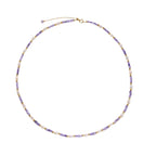 Delicate 18K gold vermeil necklace with alternating lavender zirconia beads and white freshwater pearls on cream background