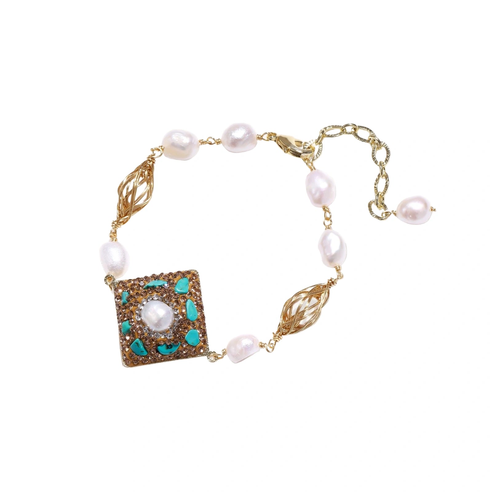 Gold-plated bracelet with baroque centerpiece, turquoise stones, freshwater pearls, and ornate chain links on cream background.