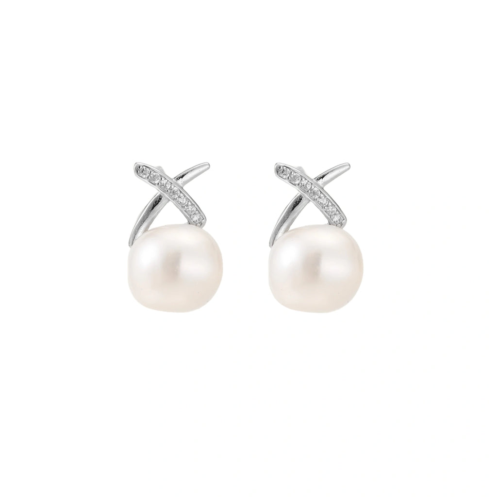 Rhodium-plated silver stud earrings with sparkling X design above lustrous round freshwater pearls on white background.