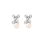Rhodium-plated silver earrings with twisted X design and freshwater pearl drops on beige background