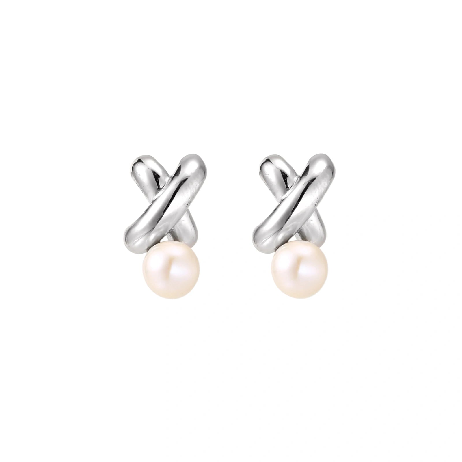 Rhodium-plated silver earrings with twisted X design and freshwater pearl drops on beige background