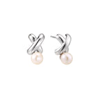Rhodium-plated silver earrings with twisted X design and freshwater pearl drops on beige background