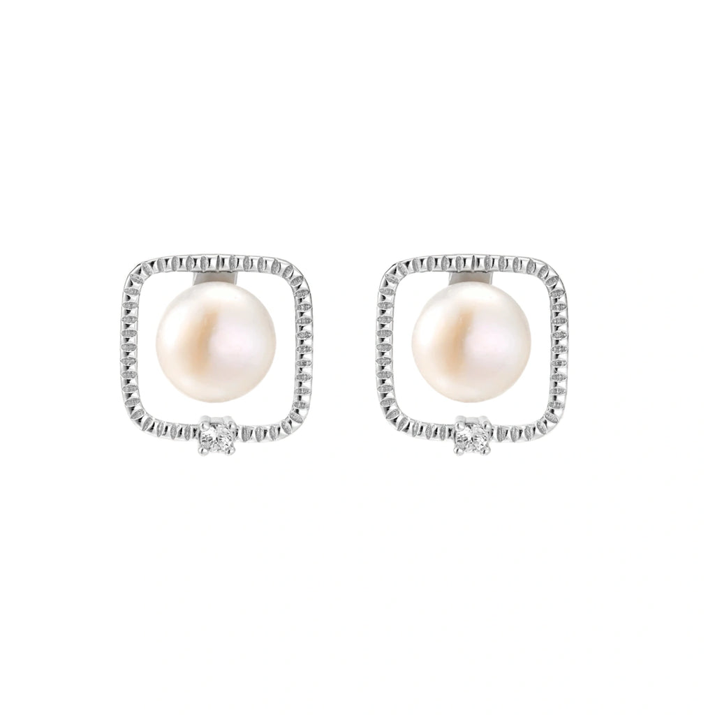 Rhodium-plated silver stud earrings with cushion frame, centered freshwater pearl, and tiny crystal accent