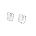 Rhodium-plated silver stud earrings with cushion frame, centered freshwater pearl, and tiny crystal accent