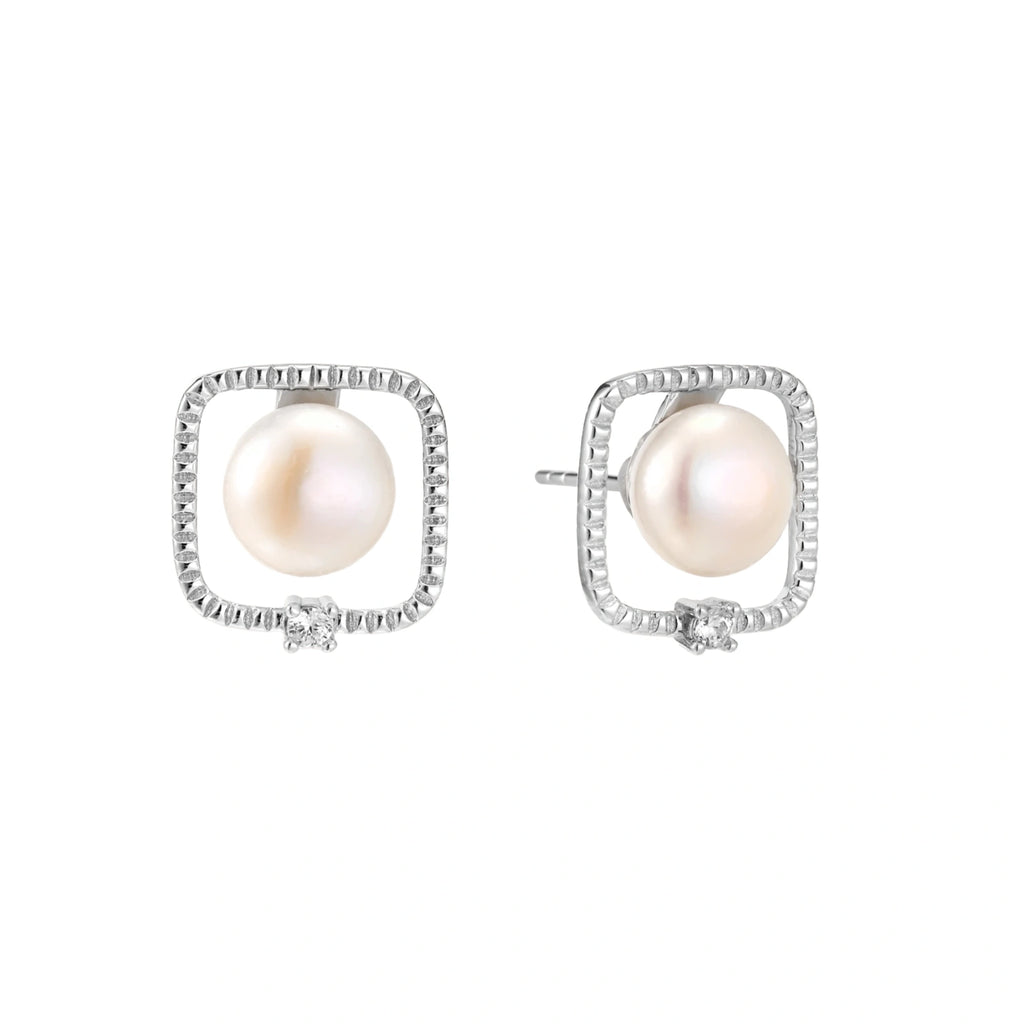 Rhodium-plated silver stud earrings with cushion frame, centered freshwater pearl, and tiny crystal accent