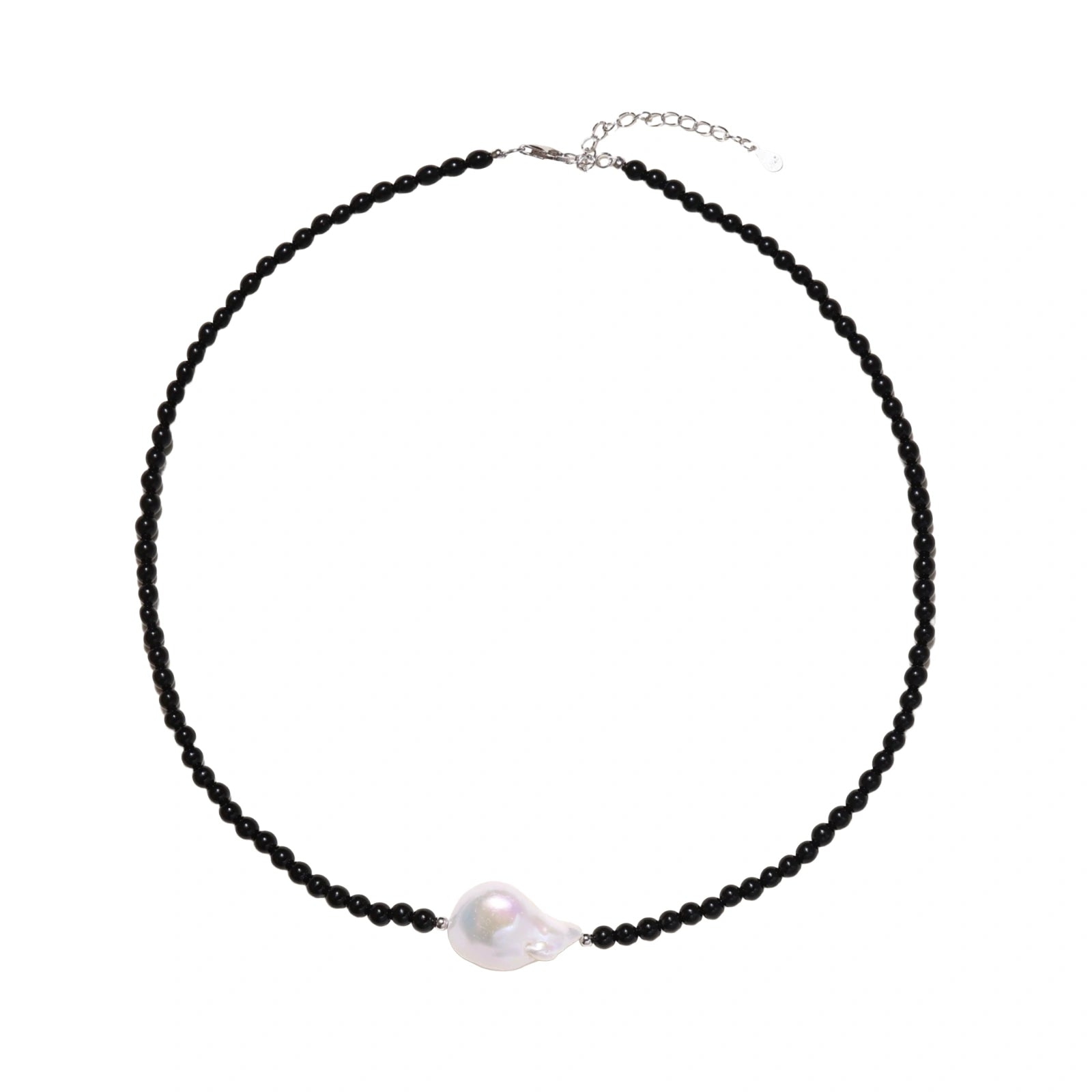 Beaded black agate necklace with iridescent baroque freshwater pearl centerpiece on cream background.
