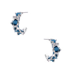White gold plated hoop earrings with woven blue denim fabric through organic branch-like metal framework