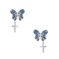 Royal blue denim butterfly earrings with white pearl centers and silver cross charms on white background