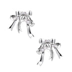 Sculptural bow earrings in polished white gold plate with sparkling zirconia stones and flowing ribbon details