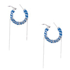 Medium hoop earrings wrapped in blue striped denim fabric with dangling silver chains on white background.