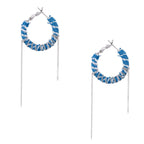 Medium hoop earrings wrapped in blue striped denim fabric with dangling silver chains on white background.
