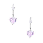 Silver huggie hoops with pink heart-cut zirconia pendants on white background, eco-friendly white gold plated brass