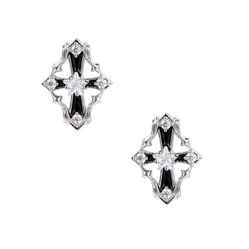 Pair of Art Deco-style stud earrings with star crystals, black enamel accents, and white gold plating on ivory background.