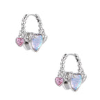 Silver chain hoop earrings with iridescent opal heart charms and pink zirconia accents on white background