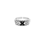 White gold plated adjustable ring with three rows of square zirconia stones in black or pink chevron pattern
