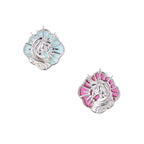 Silver unicorn stud earrings with pastel blue and pink enamel stones in sunburst prong settings on cream background