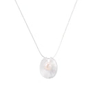 Sterling silver disc necklace with textured finish and centered freshwater pearl on delicate chain