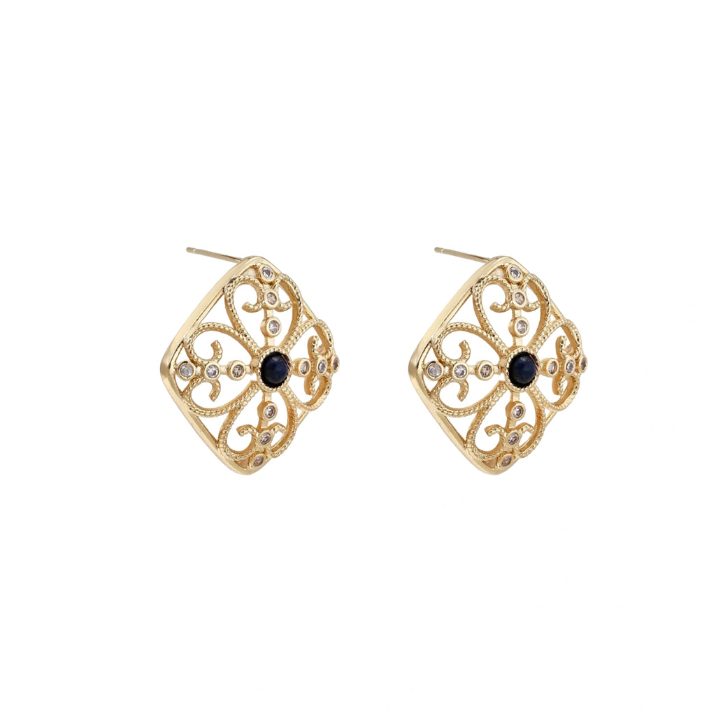 Gold filigree stud earrings with navy lapis lazuli center stone and mother-of-pearl accents in ornate quatrefoil design