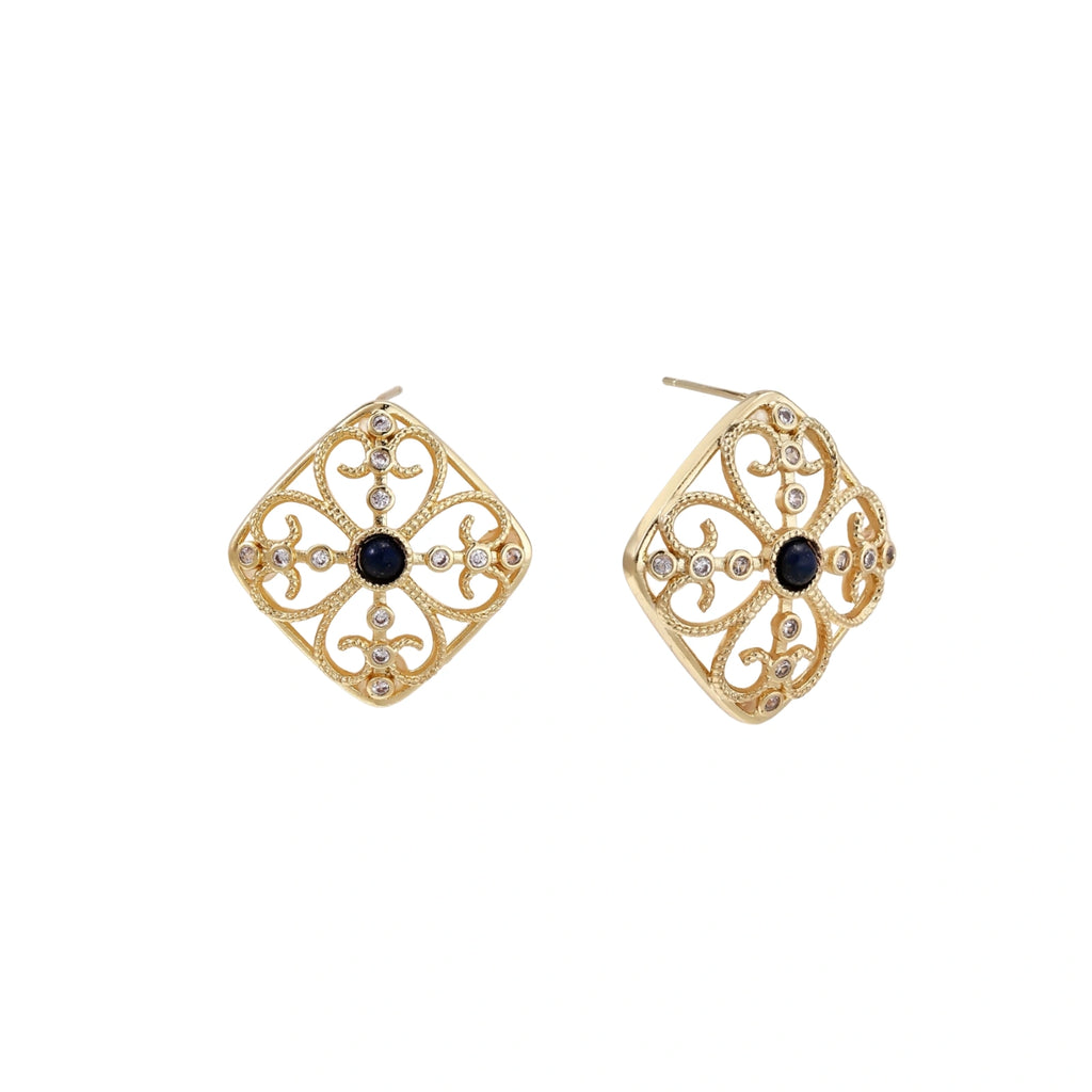 Gold filigree stud earrings with navy lapis lazuli center stone and mother-of-pearl accents in ornate quatrefoil design